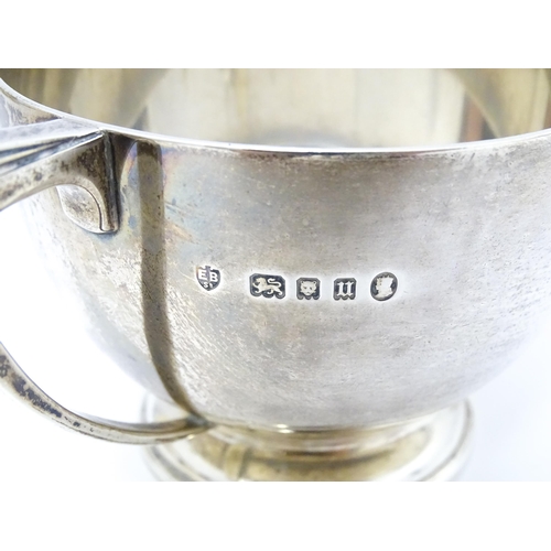 518 - An Art Deco silver four piece tea set hallmarked London 1934/35 with jubilee mark, maker Edward Barn... 