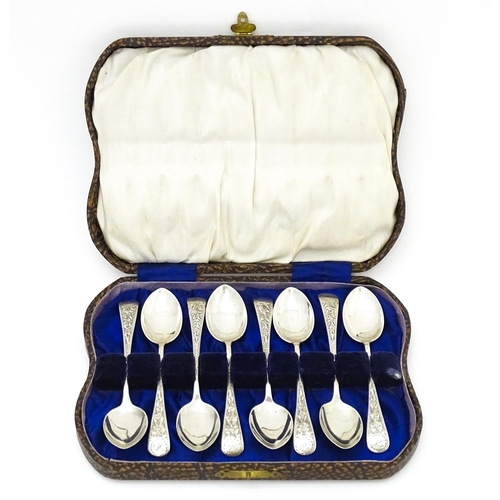 542 - A set of eight silver teaspoons with engraved foliate detail, hallmarked Birmingham 1913, maker Jose... 