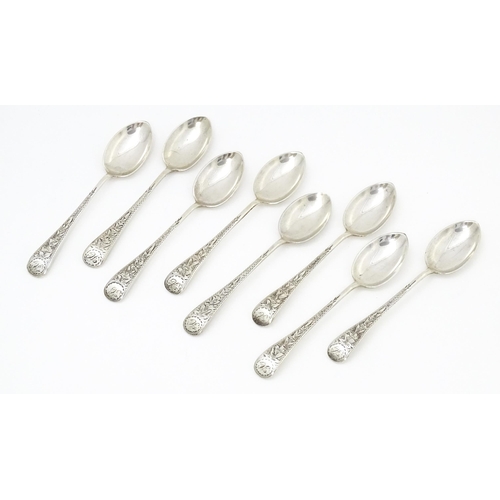 542 - A set of eight silver teaspoons with engraved foliate detail, hallmarked Birmingham 1913, maker Jose... 