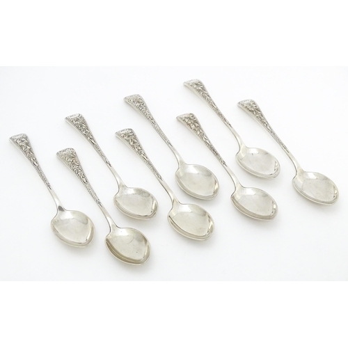 542 - A set of eight silver teaspoons with engraved foliate detail, hallmarked Birmingham 1913, maker Jose... 