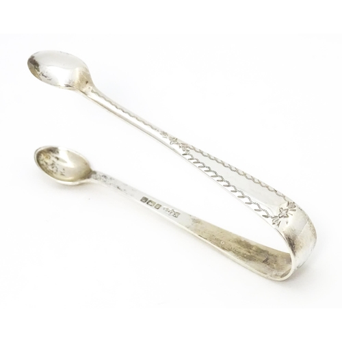 544 - A set of six silver teaspoons and sugar tongs en suite hallmarked Sheffield 1910, maker James Dixon ... 