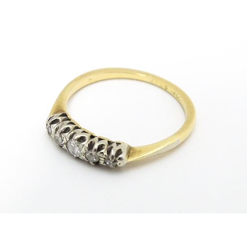 566 - An 18ct gold ring with five diamonds in a linear setting. Ring size approx. O 1/2