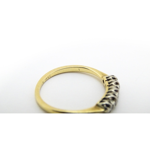 566 - An 18ct gold ring with five diamonds in a linear setting. Ring size approx. O 1/2