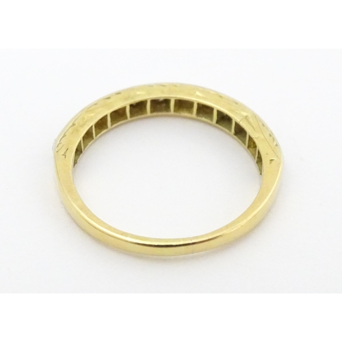 573 - An 18ct gold and platinum half eternity ring set with diamonds. Ring size approx. N 1/2