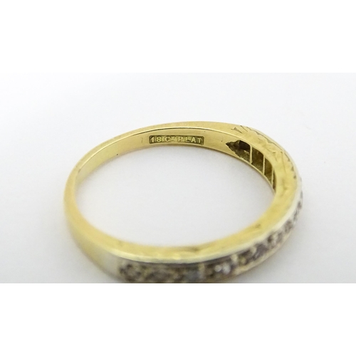 573 - An 18ct gold and platinum half eternity ring set with diamonds. Ring size approx. N 1/2