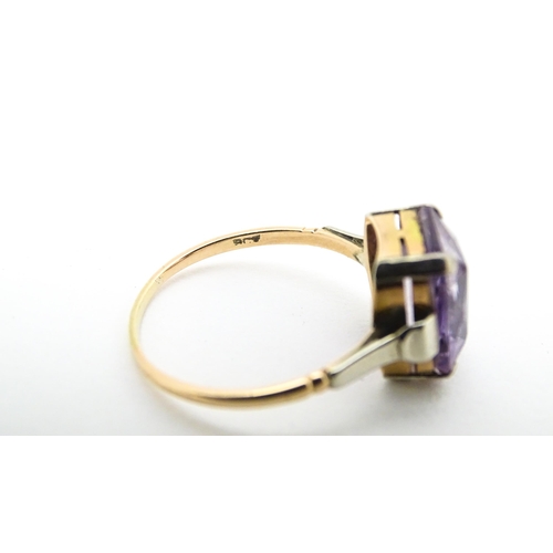 579 - An Art Deco ring set with central amethyst. Ring size approx. P