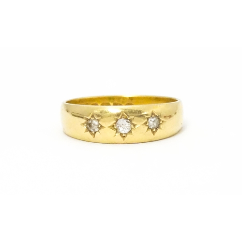 583 - A Victorian 18ct gold ring set with three diamonds. Hallmarked Chester 1897. Ring size approx. M