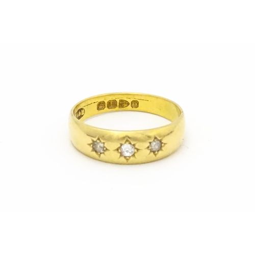 583 - A Victorian 18ct gold ring set with three diamonds. Hallmarked Chester 1897. Ring size approx. M