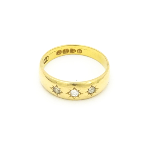 583 - A Victorian 18ct gold ring set with three diamonds. Hallmarked Chester 1897. Ring size approx. M