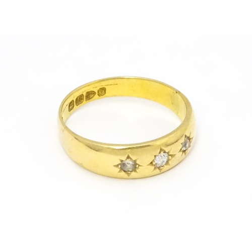 583 - A Victorian 18ct gold ring set with three diamonds. Hallmarked Chester 1897. Ring size approx. M