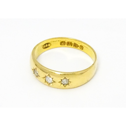 583 - A Victorian 18ct gold ring set with three diamonds. Hallmarked Chester 1897. Ring size approx. M