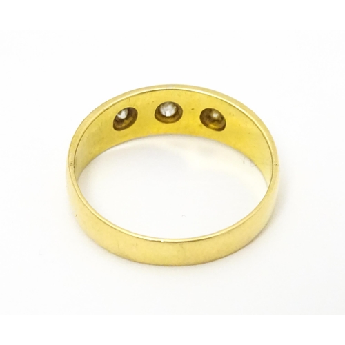 583 - A Victorian 18ct gold ring set with three diamonds. Hallmarked Chester 1897. Ring size approx. M