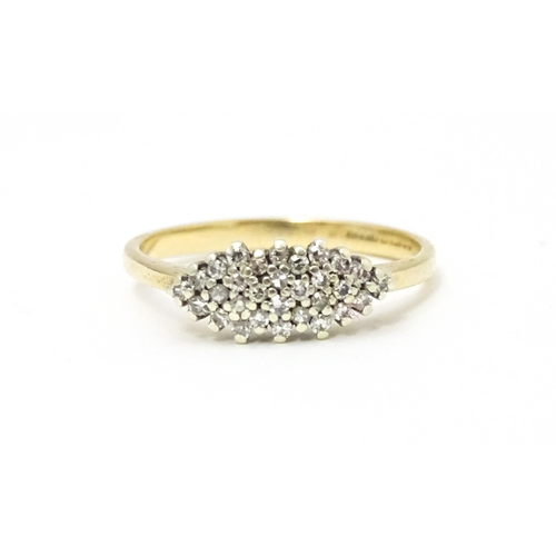 586 - A 9ct gold diamond cluster ring. Ring size approx. N 1/2.