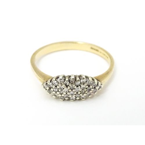 586 - A 9ct gold diamond cluster ring. Ring size approx. N 1/2.