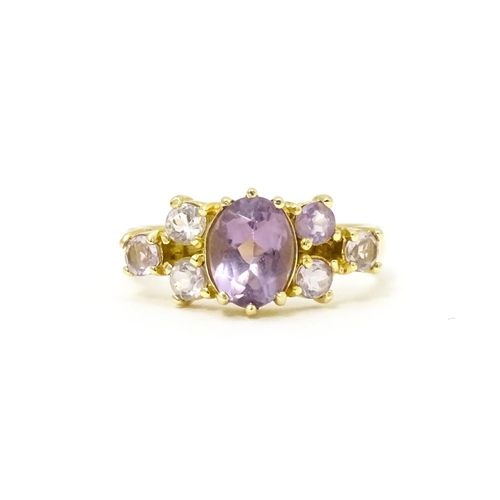 595 - A 14ct gold ring set with amethyst. Ring size approx. N.