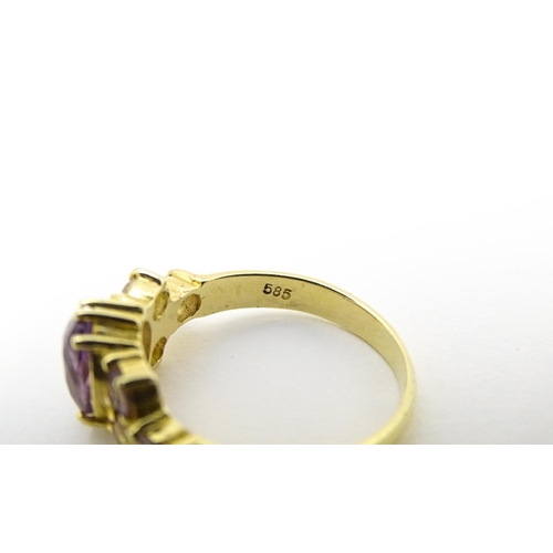 595 - A 14ct gold ring set with amethyst. Ring size approx. N.