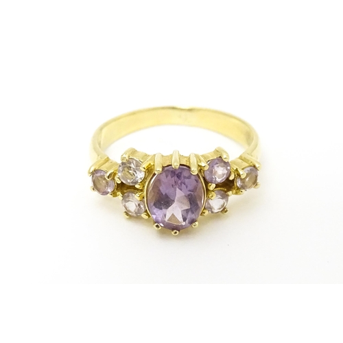 595 - A 14ct gold ring set with amethyst. Ring size approx. N.