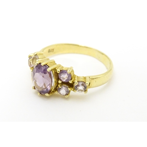 595 - A 14ct gold ring set with amethyst. Ring size approx. N.