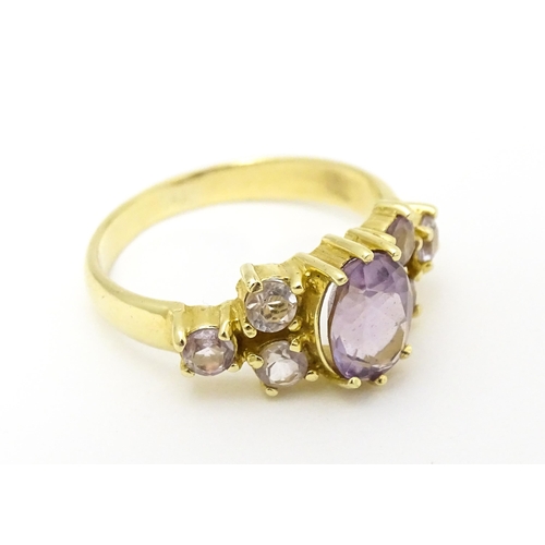 595 - A 14ct gold ring set with amethyst. Ring size approx. N.