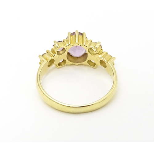 595 - A 14ct gold ring set with amethyst. Ring size approx. N.