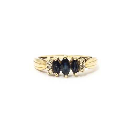 597 - A 9ct gold ring set with sapphires and diamonds. Ring size approx. O