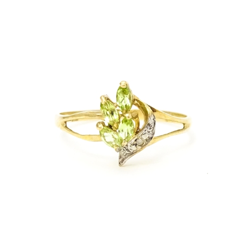 606 - A 9ct gold ring set with peridot and diamonds. Ring size approx. O