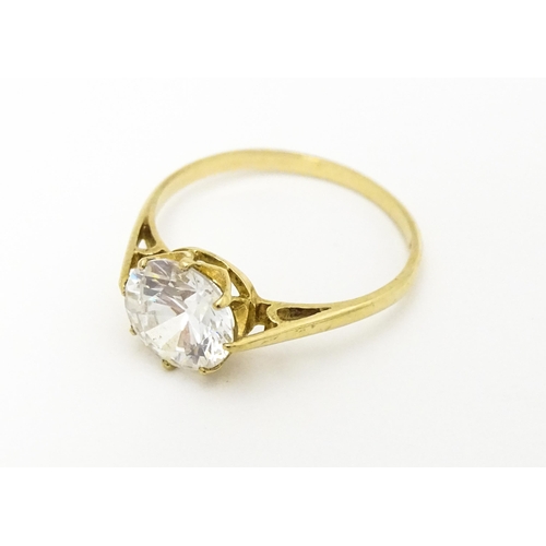 609 - A 9ct gold dress ring set with cubic zirconia. Ring size approx. L 1/2