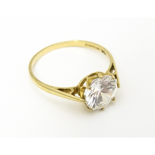 609 - A 9ct gold dress ring set with cubic zirconia. Ring size approx. L 1/2