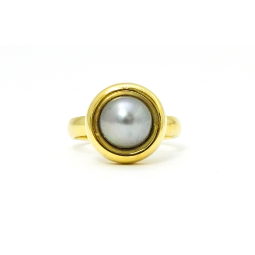 610 - A 18ct gold ring set with Blue Akoya Oyster pearl. Ring size approx. M 1/2