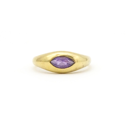 612 - A 9ct gold ring set with central marquise cut amethyst. Ring size approx. N