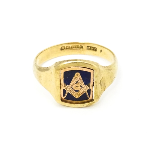 615 - Masonic / Freemasonry Interest: A 9ct gold Masonic swivel ring, the central rotating section with en... 