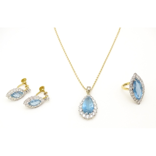 621 - An 18ct gold suite of jewellery comprising ring, pendant necklace and drop earrings, all set with ce... 