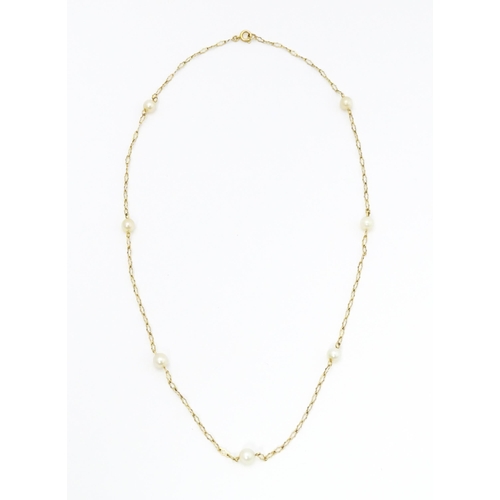 649 - A 9ct gold necklace set with pearls. Approx. 17