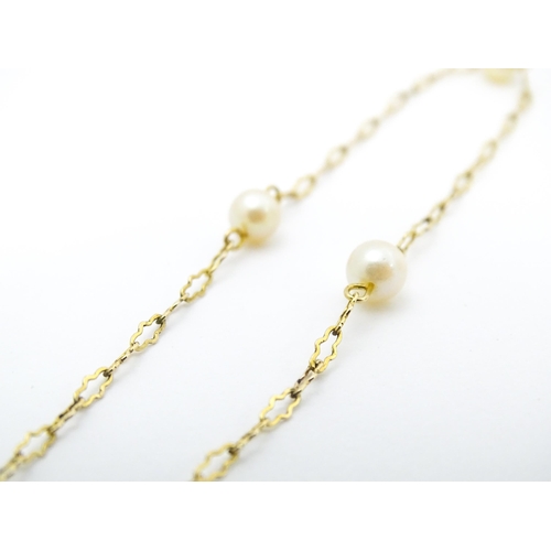 649 - A 9ct gold necklace set with pearls. Approx. 17