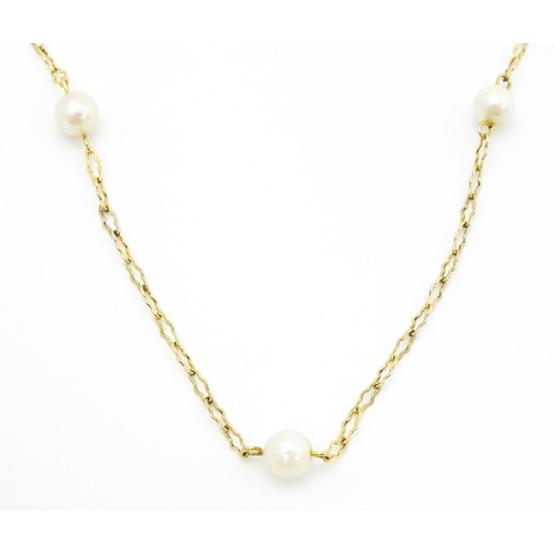 649 - A 9ct gold necklace set with pearls. Approx. 17