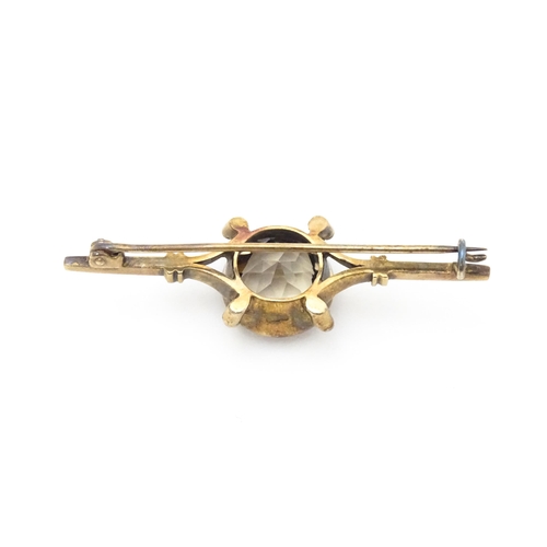 662 - A 20thC Russian silver gilt bar brooch set with central smokey topaz stone. In original box. The bro... 