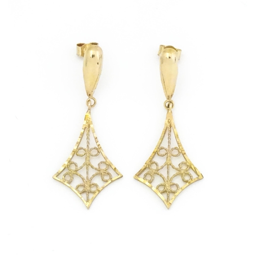 668 - A pair of 9ct gold drop earrings with filigree decoration. Approx 1 1/4