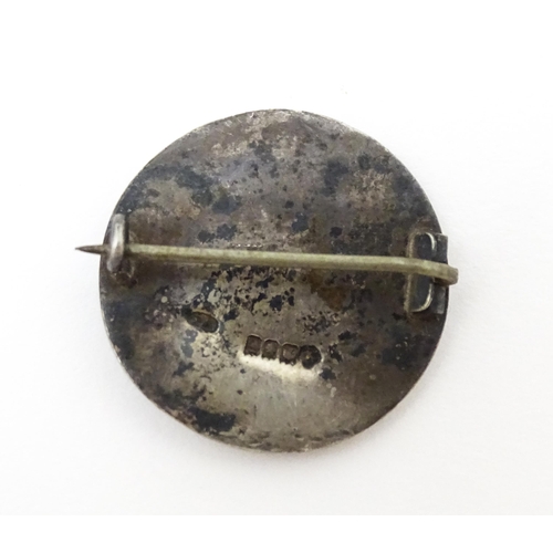 674 - A Scottish silver brooch of circular form with long boat decoration in the Iona style. Hallmarked Gl... 