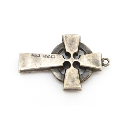 681 - A silver pendant formed as a celtic cross. Hallmarked  Chester 1924 maker William Henry Leather. App... 