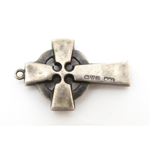 681 - A silver pendant formed as a celtic cross. Hallmarked  Chester 1924 maker William Henry Leather. App... 