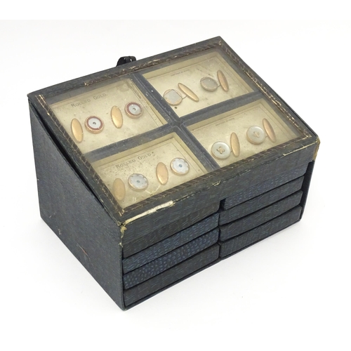 725 - A countertop jewellers display for rolled gold cufflinks with eight additional boxed pairs. Approx. ... 