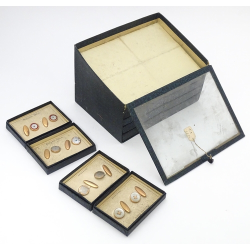 725 - A countertop jewellers display for rolled gold cufflinks with eight additional boxed pairs. Approx. ... 