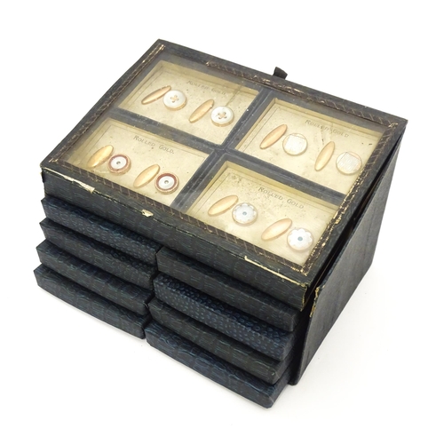 725 - A countertop jewellers display for rolled gold cufflinks with eight additional boxed pairs. Approx. ... 