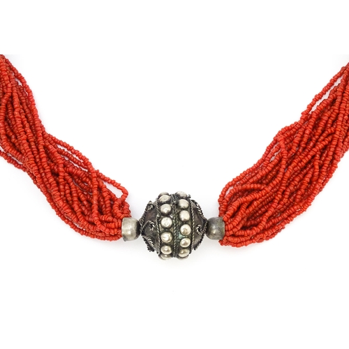 726 - A coral necklace of 23 strands with bead spacers. Approx. 26