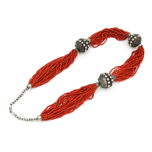 726 - A coral necklace of 23 strands with bead spacers. Approx. 26