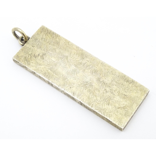 761 - A silver pendant of ingot form hallmarked Sheffield 1977 with silver Jubilee mark, maker LWJ. Approx... 