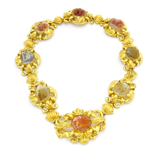 766 - A 19thC Continental gold and gilt metal parure suite of jewellery comprising necklace and drop earri... 