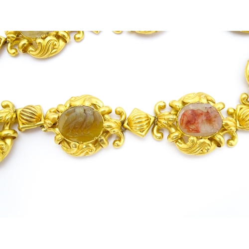 766 - A 19thC Continental gold and gilt metal parure suite of jewellery comprising necklace and drop earri... 