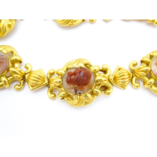 766 - A 19thC Continental gold and gilt metal parure suite of jewellery comprising necklace and drop earri... 