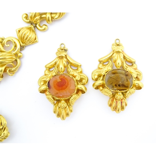 766 - A 19thC Continental gold and gilt metal parure suite of jewellery comprising necklace and drop earri... 